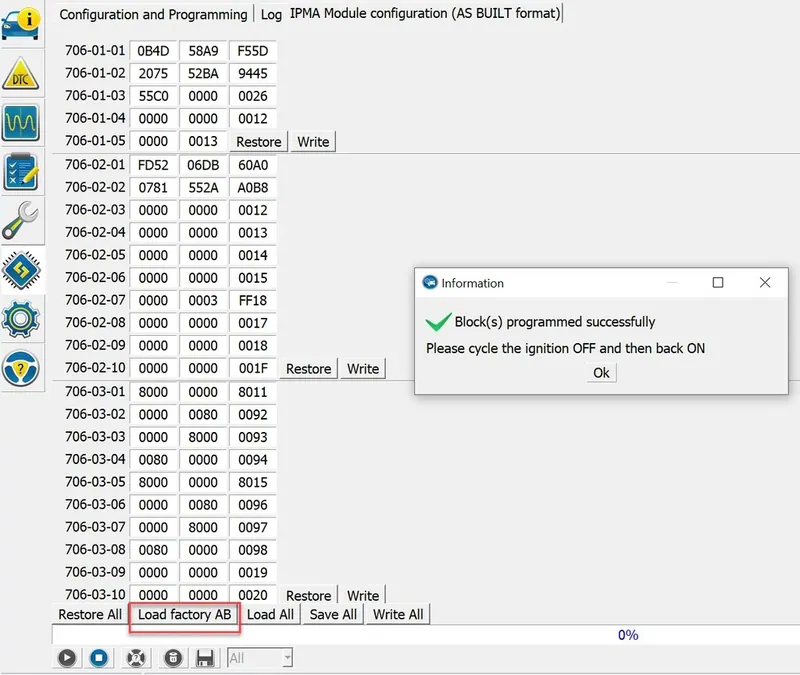 A laptop running automotive diagnostic and programming software connected to a vehicle via a J2534 pass-thru device.