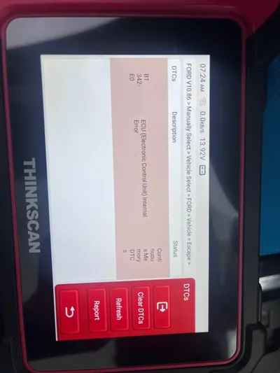 An OBD2 diagnostic scan tool displaying ABS module trouble codes such as B1342 or U2300.