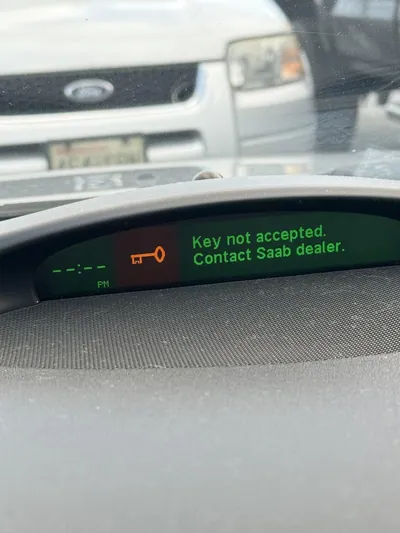 Saab Information Display (SID) showing the 'Key not accepted' error message on the dashboard.