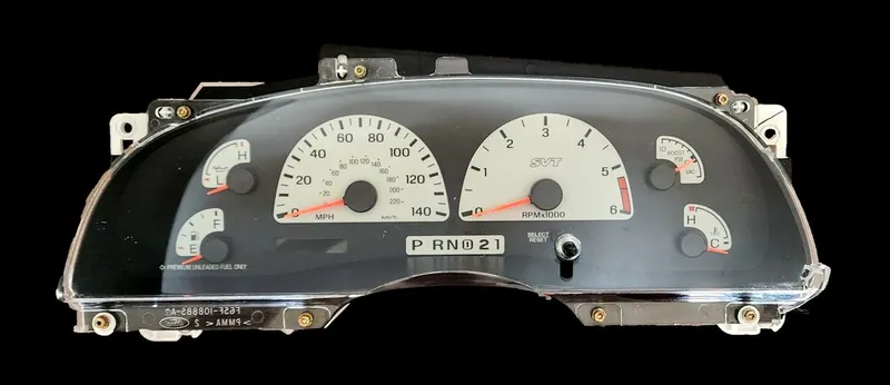 A 2000 Ford F-150 instrument cluster with the digital odometer displaying a row of dashes instead of the mileage.
