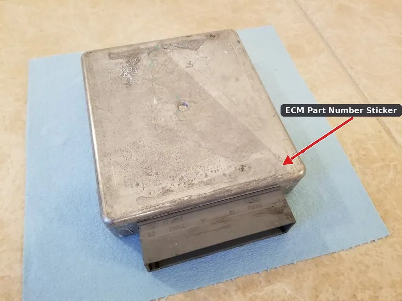 A used 2003 Ford Taurus Engine Control Module showing the OEM part number and hardware code label.