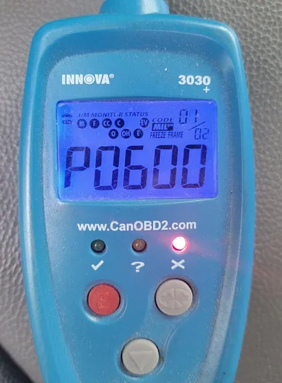 An OBD2 scanner displaying a P0600 Serial Communication Link Malfunction code, indicating a potential ECM failure.