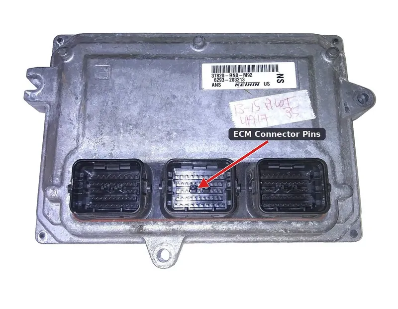 A used OEM Engine Control Module for a 2012-2015 Honda Pilot, showing the metal casing and electrical connector pins.