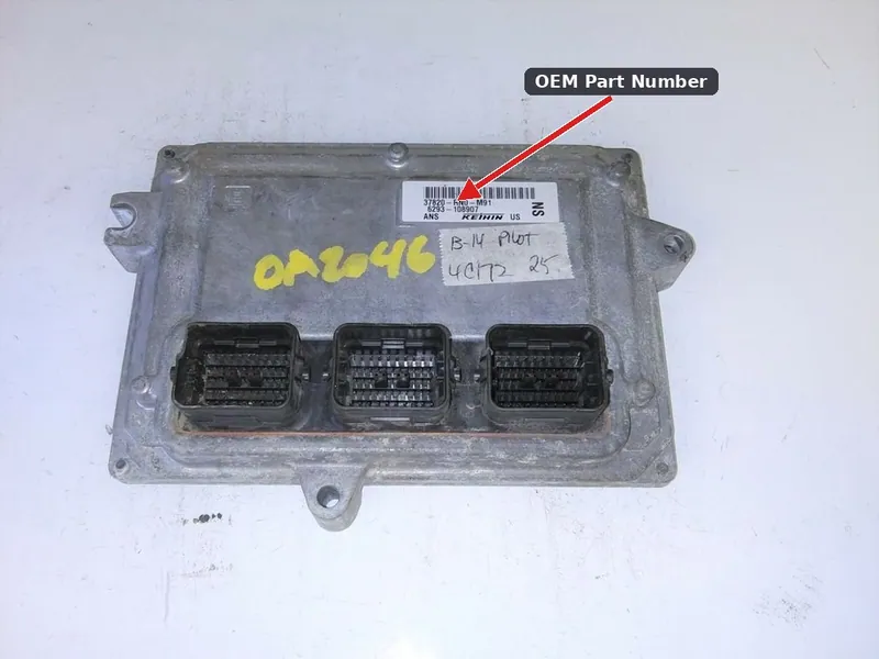 A used Honda Pilot Engine Control Module showing the manufacturer part number sticker and electrical connector pins.