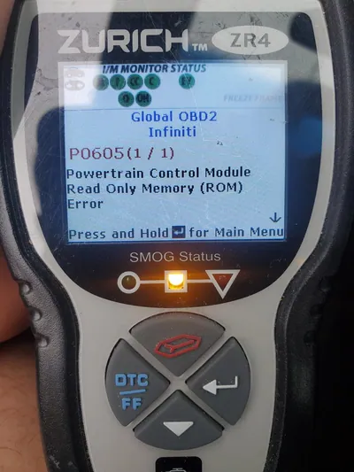 An OBD2 diagnostic scanner displaying a P0600 internal control module error code.