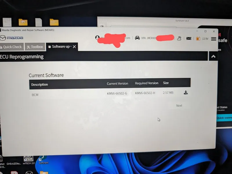 A technician using Mazda Diagnostic And Repair Software (MDARS) to program a new ECM for a Mazda CX-30.
