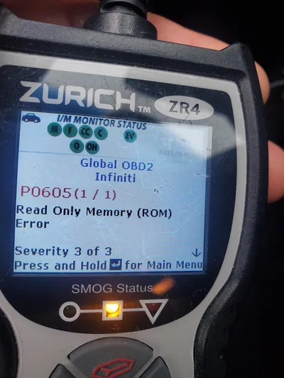 An OBD2 diagnostic scanner displaying the P0605 diagnostic trouble code for an Internal Control Module ROM Error.