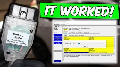 A laptop running automotive diagnostic software connected to a vehicle for ECM programming.