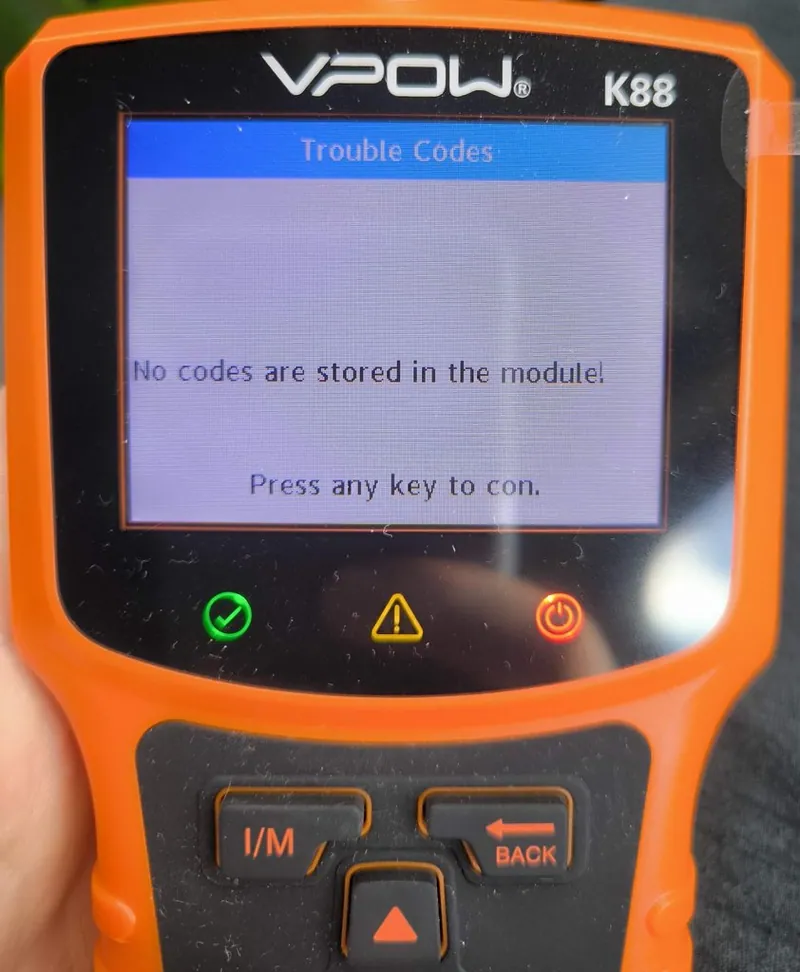 An OBD2 scanner displaying the B1400 diagnostic trouble code.