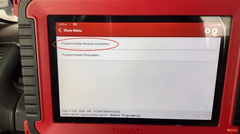 An advanced diagnostic scan tool displaying module configuration options.