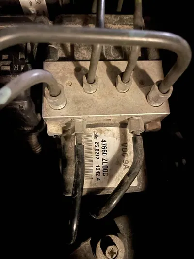 An automotive ABS and Vehicle Dynamics Control (VDC) module assembly.