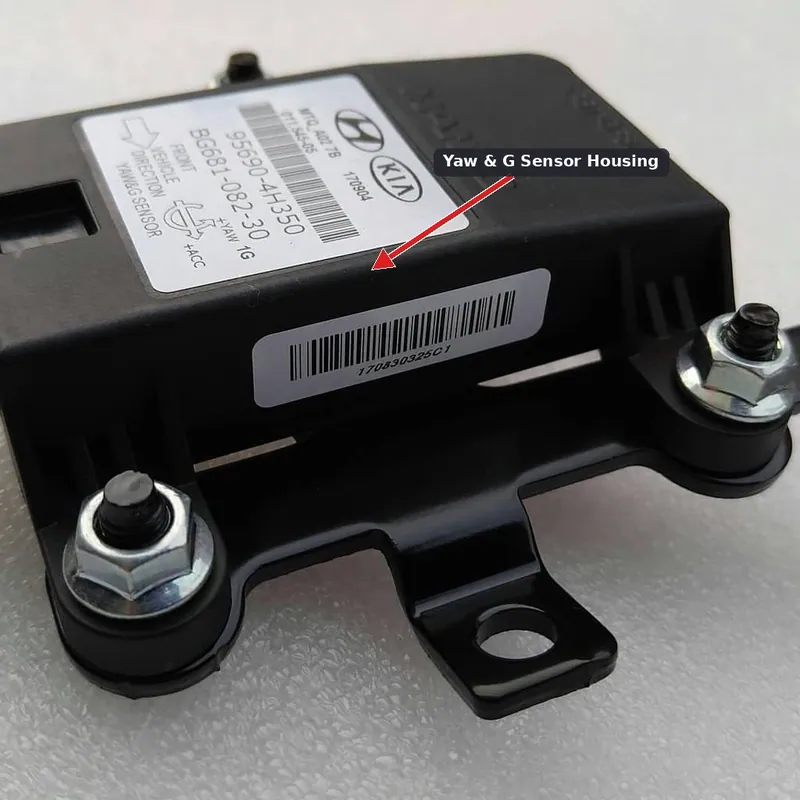 A lateral acceleration and yaw rate sensor module securely bolted to a vehicle's center floorboard.