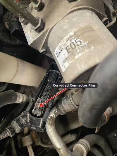 A damaged and chafed wiring harness leading to an ABS control module.