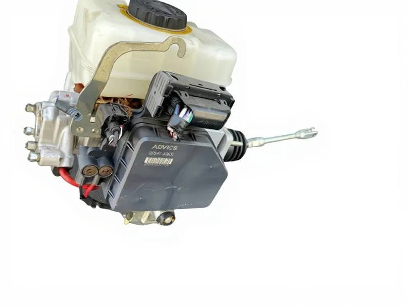 An ABS actuator and control module assembly with hydraulic brake lines attached.
