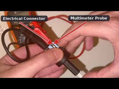 A mechanic using a digital multimeter to test the continuity of a brake light switch located above the brake pedal.
