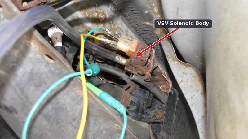 A rusted vacuum switching valve attached to a vehicle's charcoal canister.