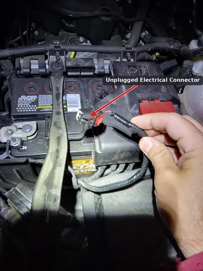 A disconnected electrical connector for a battery temperature sensor located beneath a vehicle's battery tray.