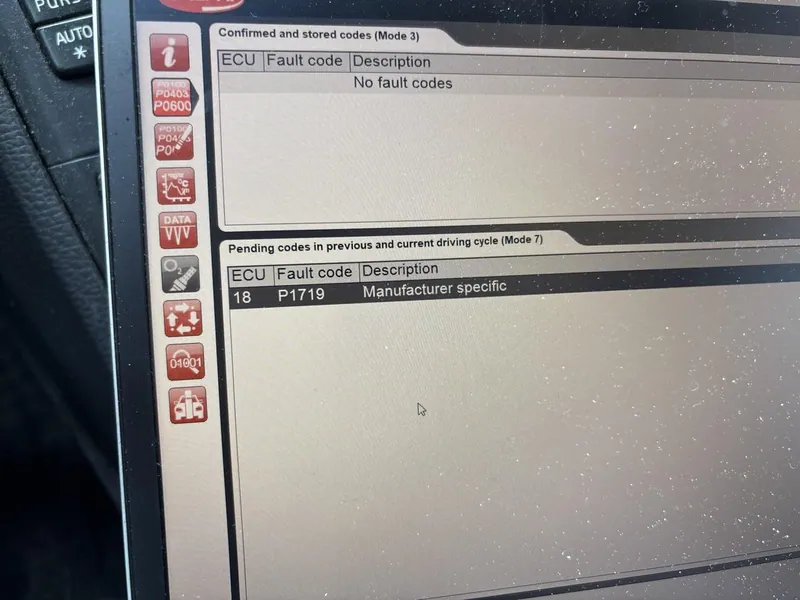 An OBD2 scanner displaying the P1719 diagnostic trouble code.
