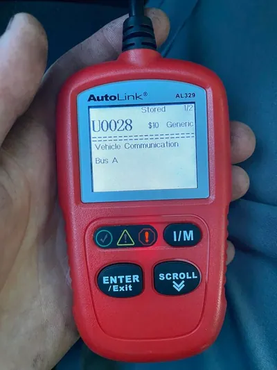 An OBD2 diagnostic scanner displaying the U0028 trouble code for Vehicle Communication Bus A Fault.