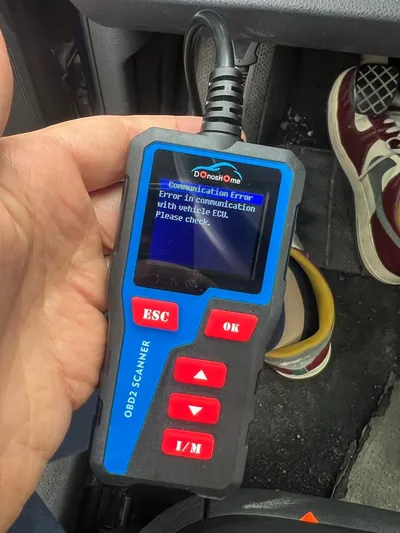 A professional automotive diagnostic scan tool displaying a 'Lost Communication' U-code on its screen.