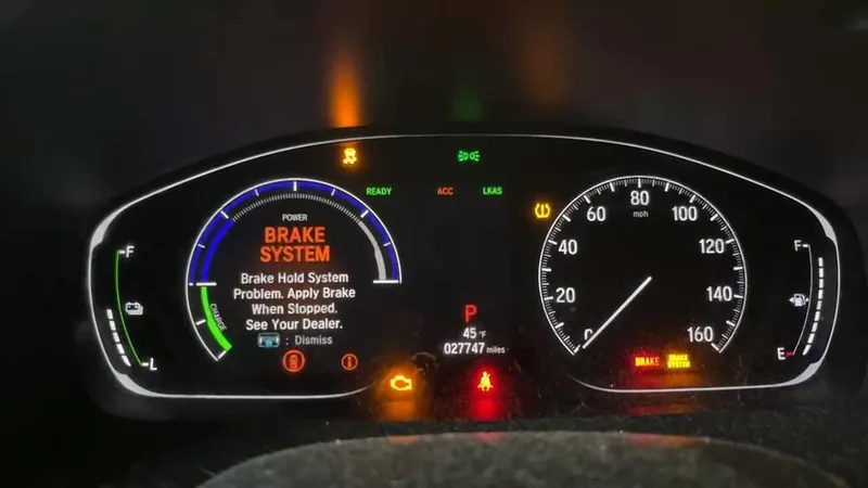 A car dashboard illuminated with multiple warning lights, including ABS, Check Engine, and traction control.