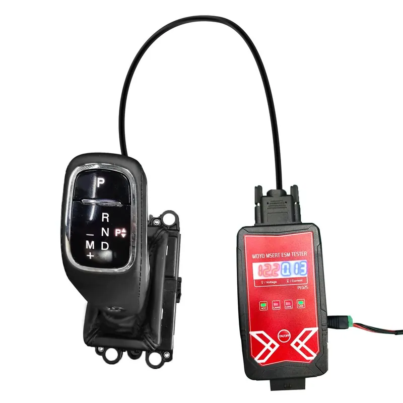 A modern electronic gear shift module removed from a vehicle's center console.