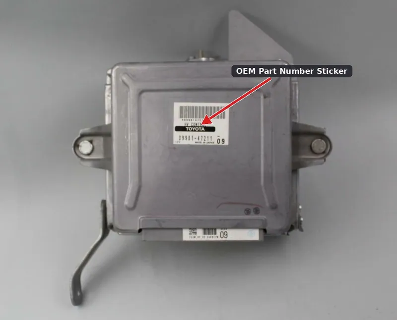 A used hybrid inverter assembly sitting on a workbench, with the manufacturer part number label clearly visible.