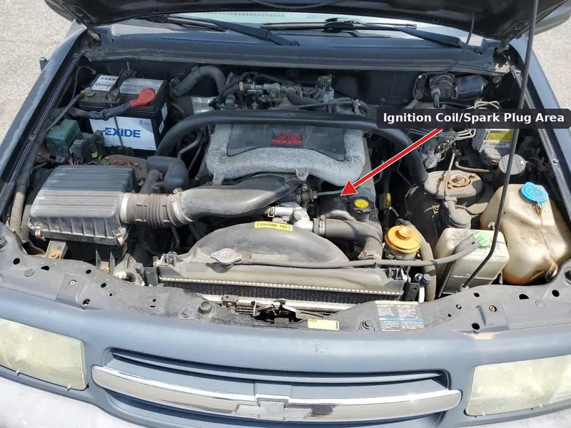 The engine bay of a Chevrolet Tracker showing the location of the ignition system.