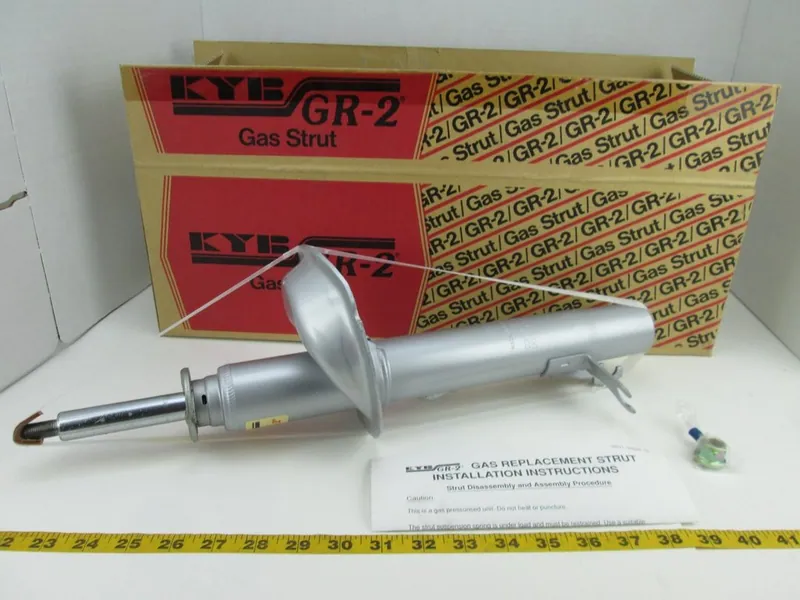 A selection of aftermarket performance and OEM-style replacement struts from brands like KYB and Bilstein.
